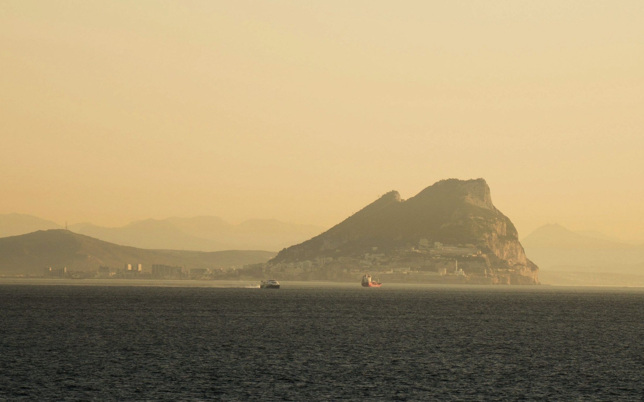 The Rock of Gibraltar at golden hour, seen across the strait
